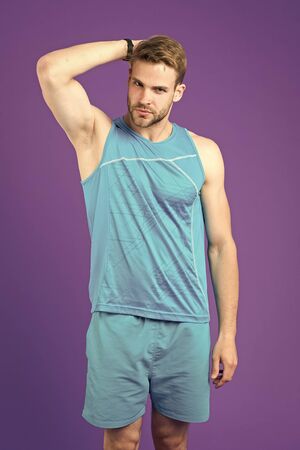 Sportsman after training feel pleasant aroma. Guy check armpit dry skin. Prevent or reduce perspiration. Choose proper antiperspirant or deodorant for training. Man satisfied his antiperspirant.の写真素材