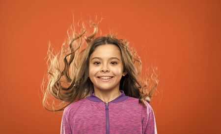 Portrait of happy little child. Kid fashion and sportswear.の写真素材