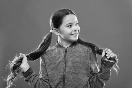 Girl active kid with long gorgeous hair.