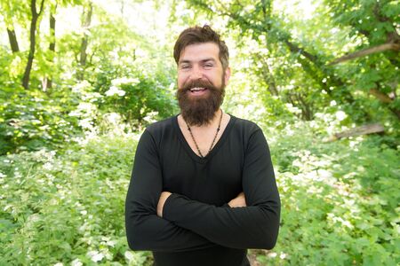 Immersing himself in a vacation in close contact with nature. Bearded man enjoying summer vacation....