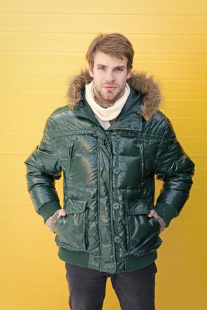 Improved protection for cold season. Fashion model enjoying warmth and comfort. Handsome man wearing...