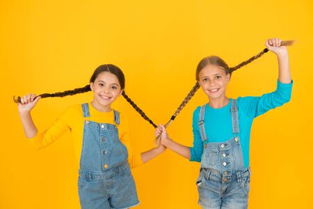 Living happy life in free country. Patriotic upbringing. We are ukrainians. Ukrainian kids. Children ukrainian young generation. Patriotism concept. Girls with blue and yellow clothes. Freedom valueの写真素材