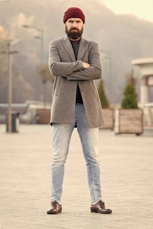Stylish casual outfit spring season. Menswear and male fashion concept. Man bearded hipster stylish fashionable coat and hat. Comfortable outfit. Refreshing walk. Hipster outfit and hat accessoryの写真素材