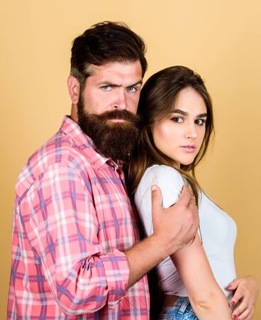 Love language. bearded man hipster with girl. hairdresser and barber concept. male and female fashion. valentines day. sexy woman and brutal guy with beard. passion couple. couple in loveの写真素材