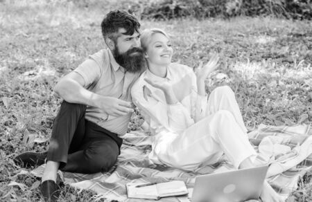 Couple with laptop relax natural environment. Family enjoy relax nature background. Couple bearded...