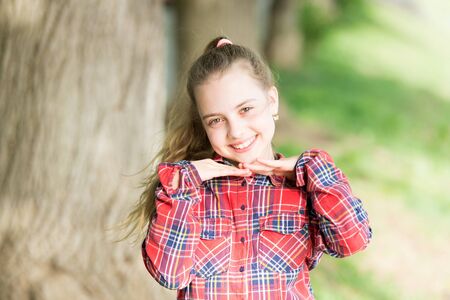 Emotional kid nature background. Child care. Vacation time for relax. Positive emotions. Small girl relaxing in park. Little child enjoy walk park. Weekend time. Girl carefree child. Summer holidaysの写真素材