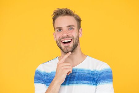 Happy emotional guy close up. Positive emotions. Happy man on yellow background. Bearded man...