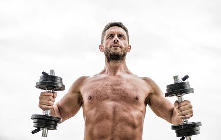 Best exercise. Muscular man exercising with barbell. fitness and sport equipment. man sportsman with strong ab torso. steroids. athletic body. Dumbbell gym. success. Perfect six packの写真素材