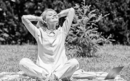 Reasons you should meditate every day. Clear your mind. Girl meditate on rug green grass meadow...
