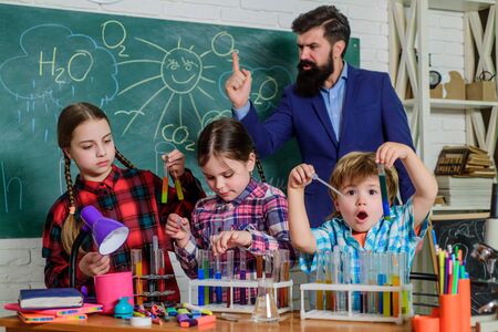 Studying atmosphere. Laboratory Research - Scientific project For Chemical test. Science and education. chemistry lab. happy children teacher. back to school. School chemistry laboratoryの写真素材