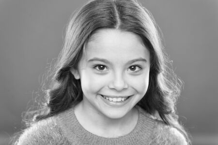 Smile like a model. Little girl with healthy white smile. Small child with pretty smile on cheerful...
