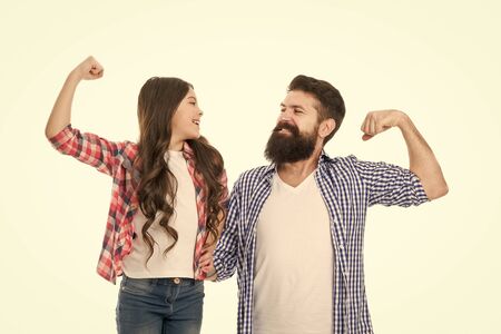 Strong as my father. Parenthood and childhood. Fathers day concept. Lovely father and cute kid strong family. Father and daughter hug white background. Child and dad best friends show biceps gestureの写真素材