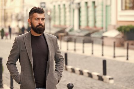 The beginning of working day. Bearded man going to work. Hipster in business style on street. Business man in modern city. Professional businessman leading busy lifestyle. Confident and successfulの写真素材