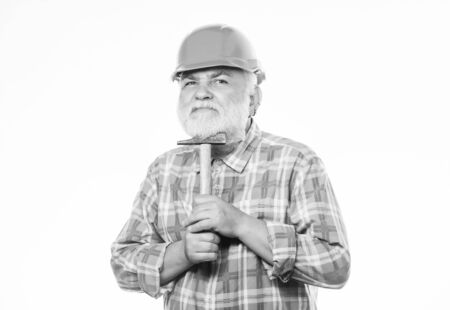 Repairing or renovating. Home improvement repair. Man bearded laborer wear helmet hold hammer....