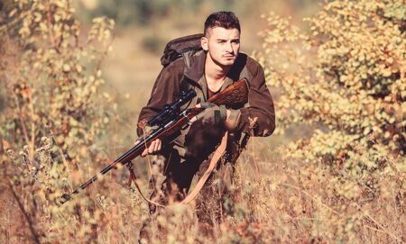 Hunting is brutal masculine hobby. Bearded serious hunter spend leisure hunting. Hunter hold rifle....