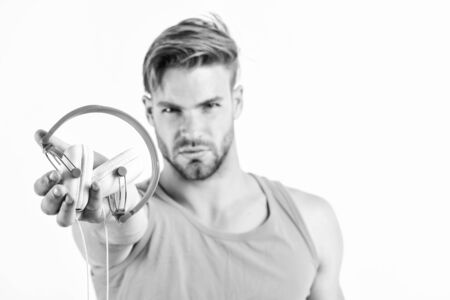 Shop store musical accessory gadgets. Sale discount. Enjoy perfect music sound headphones. Man guy listening music headphones white background. Music fan concept. Modern technology. Buy music gadgetの写真素材