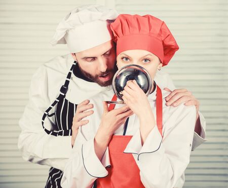 chefs compliment. man and woman chef in restaurant. couple in love with perfect food. Family cooking in kitchen. secret ingredient by recipe. cook uniform. Menu planning. culinary cuisineの写真素材