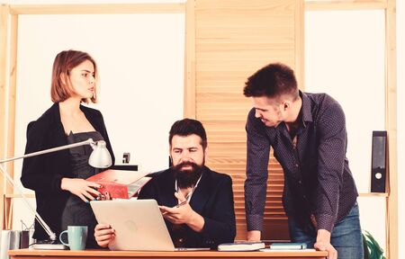 Office collective concept. Coworkers communicate solving business tasks. Working together. Working process. Business meeting. Female small minority. Woman attractive lady working with men colleaguesの写真素材