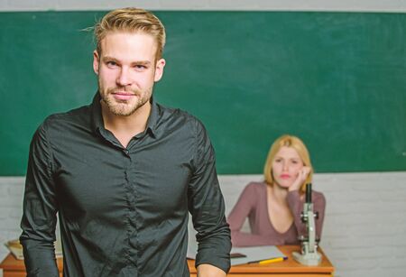 Man well groomed attractive teacher in front of classroom. Obsessed with knowledge. Teacher of her dreams. Handsome teacher. School and college education. Successfully graduated. Youth mentoringの写真素材