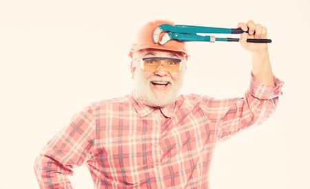 Carpenter in despair. mature bearded man in hardhat. professional repairman in helmet with gas...