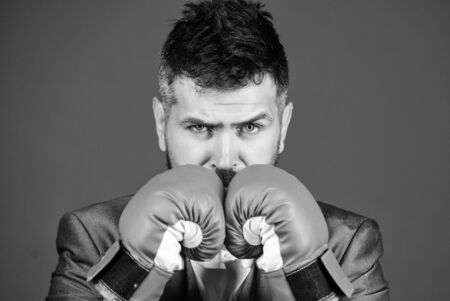 Criminal defense lawyer planning out strategies. Businessman wear boxing gloves. Best criminal defense lawyer strategies. Attack and defense concept. Achieve success. Tactics proven to workの写真素材