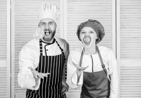 Cooking healthy food. Fresh vegetarian healthy food recipe. Fresh vegetables. Join healthy lifestyle. Vegetarian family. Woman and bearded man cooking together. Chefs of organic food restaurantの写真素材
