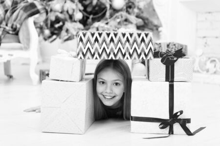 Home is the best place in the world. The morning before Xmas. Little girl. Happy new year. Winter. xmas online shopping. Family holiday. Christmas tree and presents. Child enjoy the holidayの写真素材