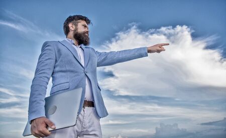 Changing course. Looking for opportunities and new chances. Developing business direction. Man formal suit manager looking direction. New business direction. Businessman bearded face sky backgroundの写真素材