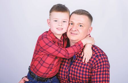 Cool guys. Father little son red shirts family look outfit. Best friends forever. Happiness being father of boy. Dad and adorable child. Parenthood concept. Fathers day. Father example of noble humanの写真素材