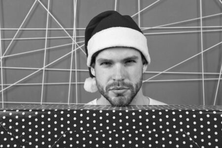 Santa bring gift for you. Man attractive santa claus carry big box. Ready to unpack your gift....