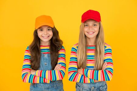 Carefree and happy childhood. Happy childrens day. Family look. Friendly and happy children. Stylish children. International childrens day. Happy smiling girls sisters best friends. True friendshipの写真素材