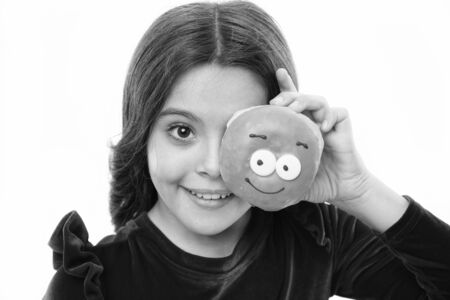 Girl hold glazed cute donut in hand white background. Kid smiling girl ready to bite donut. Sweets shop and bakery concept. Kids huge fans of baked donuts. Can you resist fresh made to order donutの写真素材