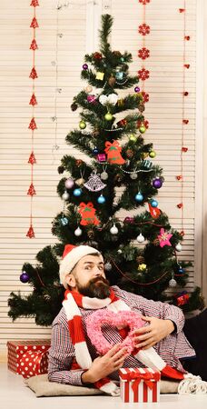 Man with excited face on Christmas treeの写真素材