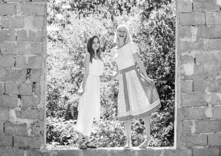 Friendship concept. Girls friends summer dress outfit natureの写真素材