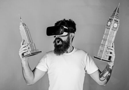 Guy holds Big Ben and Empire State Building.の写真素材