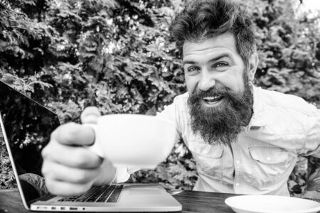 happy man working on laptop. brutal bearded hipster at coffee break. office worker. Successful businessman. agile business. Business success. perfect deal. Making great decisions.の写真素材