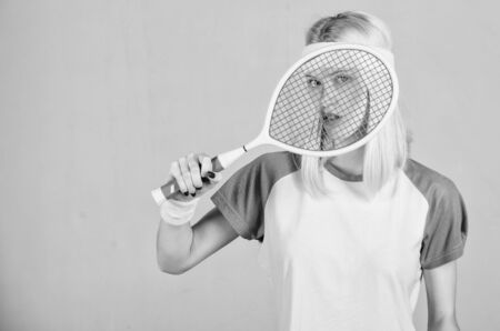 Sport for maintaining health. Athlete hold tennis racket in hand. Tennis club concept. Tennis sport and entertainment. Active leisure and hobby. Girl adorable blonde play tennis. Start play gameの写真素材