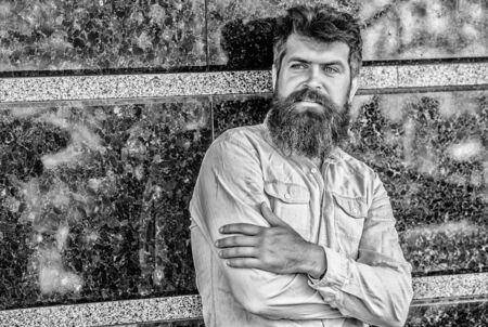 Guy masculine appearance with long beard. Barber concept. Beard grooming. Beard care. Man attractive bearded hipster posing outdoors. Masculinity and manliness. Confident posture of handsome manの写真素材