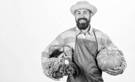 Joyful mood. bearded mature farmer. seasonal vitamin food. Useful fruit and vegetable. organic and natural food. happy halloween. man chef with rich autumn crop. harvest festivalの写真素材