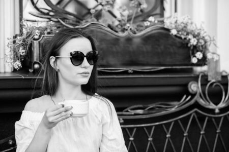 Caffeine dose. Coffee for energetic successful day. Breakfast time in cafe. Girl enjoy morning coffee. Woman drink coffee outdoors. Peaceful inspiring moment. Girl relax in cafe cappuccino cupの写真素材