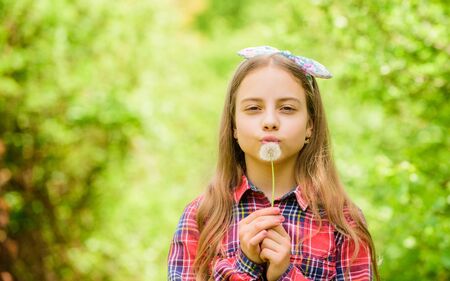 Make a wish. Girl teen dressed country rustic style checkered shirt nature background. Celebrating return of summer. Dandelion is beautiful and full of symbolism. Summer is here. Summer garden flowerの写真素材