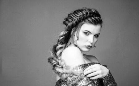 Girl makeup face braided long hair. French braid. Professional hair care and creating hairstyle....