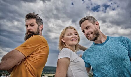 Ruined relationships. How deal with offended feelings. Girl stand between two men. Psychology of breakup. What do when you feel rejected. Couple and rejected partner. How get over breakup for guysの写真素材