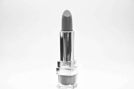 Adding some shine to lips. Lip care concept. Lipstick on white background. Water resistant high quality lipstick product. Must have. Beauty trend. Daily make up. Lipstick for professional make upの写真素材