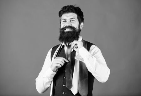 Looking great in business. Hipster choosing necktie for business meeting. Confident business man with luxury tie collection. Bearded man dressing in formal business styleの写真素材