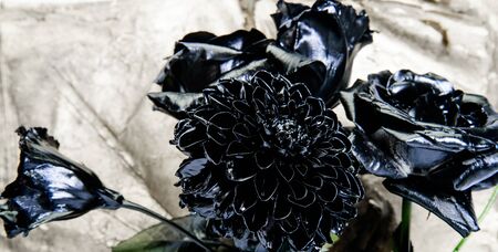 Fashion bouquet. Botany concept. Forging and sculpture. Beautiful black silver flower. Floral shop. Metallic steel color. Flower covered metallic paint. Metal flower. Abstract art. Eternal beauty.の写真素材