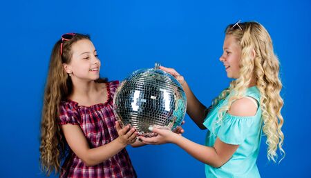 party fun. small girls with disco ball. party goers. happy birthday. holiday celebration. dancing...