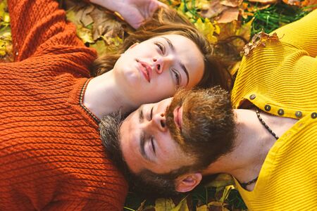 Girl and bearded guy or happy lovers on date cuddleの写真素材