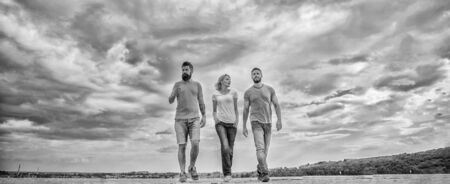 United group purposefully moves forward. Friendship tested for years. Men and woman walks dramatic...