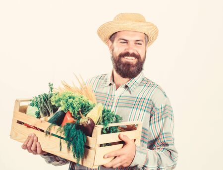 Farmer lifestyle professional occupation. Buy local foods. Farmer rustic bearded man hold wooden box...